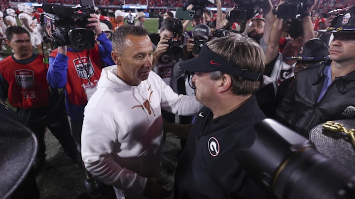 Nov 15, 2025; Athens, Georgia, USA; Texas Longhorns head coach Steve Sarkisian and Georgia Bulldogs head coach Kirby Smart interact after a game at Sanford Stadium. Mandatory Credit: Brett Davis-Imagn Images Nov 15, 2025; Athens, Georgia, USA; Texas Longhorns head coach Steve Sarkisian and Georgia Bulldogs head coach Kirby Smart interact after a game at Sanford Stadium. Mandatory Credit: Brett Davis-Imagn Images