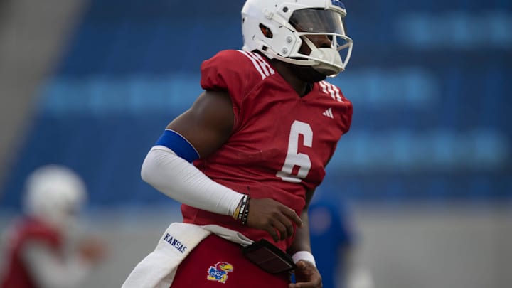 Kansas redshirt senior quarterback Jalon Daniels (6) runs to position during their first practice inside David Booth Kansas Memorial Stadium on Aug. 1, 2025.