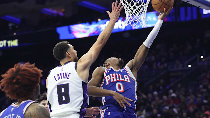 Jan 29, 2026; Philadelphia, Pennsylvania, USA; Philadelphia 76ers guard Tyrese Maxey (0) drives for a shot against Sacramento Kings guard Zach LaVine (8) during the fourth quarter at Xfinity Mobile Arena. Mandatory Credit: Bill Streicher-Imagn Images