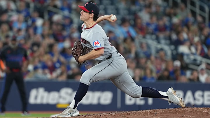 May 2, 2025; Toronto, Ontario, CAN; Cleveland Guardians relief pitcher Matt Festa (52) throws a pitch against the Toronto Blue Jays during the sixth inning at Rogers Centre. Mandatory Credit: Nick Turchiaro-Imagn Images