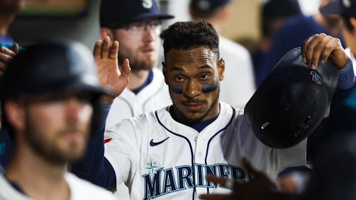 Aug 25, 2025; Seattle, Washington, USA; Seattle Mariners second baseman Jorge Polanco (7) high-fives teammates in the dugout after scoring a run against the San Diego Padres during the fifth inning at T-Mobile Park. Mandatory Credit: Joe Nicholson-Imagn Images Aug 25, 2025; Seattle, Washington, USA; Seattle Mariners second baseman Jorge Polanco (7) high-fives teammates in the dugout after scoring a run against the San Diego Padres during the fifth inning at T-Mobile Park. Mandatory Credit: Joe Nicholson-Imagn Images