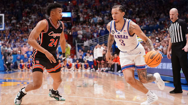 Kansas Jayhawks guard Tre White (3) drives the ball against Houston Cougars during the game inside Allen Fieldhouse on Monday, Feb. 23, 2026.
