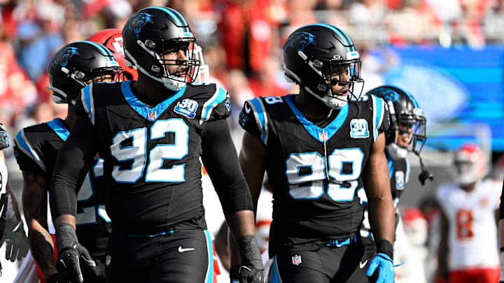 Nov 24, 2024; Charlotte, North Carolina, USA; Carolina Panthers defensive end Jonathan Harris (92) and linebacker D.J. Wonnum (98) on the field in the first quarter at Bank of America Stadium.