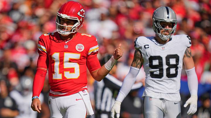 Oct 19, 2025; Kansas City, Missouri, USA; Kansas City Chiefs quarterback Patrick Mahomes (15) gestures as Las Vegas Raiders defensive end Maxx Crosby (98) looks on during the first quarter of the game at GEHA Field at Arrowhead Stadium. Mandatory Credit: Jay Biggerstaff-Imagn Images Oct 19, 2025; Kansas City, Missouri, USA; Kansas City Chiefs quarterback Patrick Mahomes (15) gestures as Las Vegas Raiders defensive end Maxx Crosby (98) looks on during the first quarter of the game at GEHA Field at Arrowhead Stadium. Mandatory Credit: Jay Biggerstaff-Imagn Images