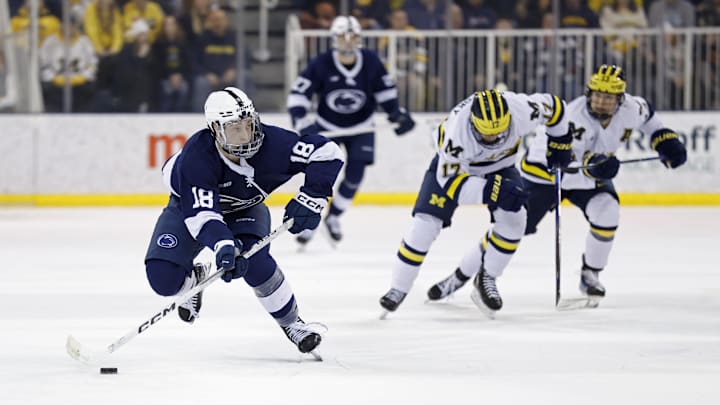 Mar 7, 2025; Ann Arbor, MI, USA; Penn State forward Aiden Fink (18) skates with the puck in the second period against the Michigan Wolverines during a Big Ten Tournament quarter final game at Yost Arena. Mandatory Credit: Rick Osentoski-Imagn Images Mar 7, 2025; Ann Arbor, MI, USA; Penn State forward Aiden Fink (18) skates with the puck in the second period against the Michigan Wolverines during a Big Ten Tournament quarter final game at Yost Arena. Mandatory Credit: Rick Osentoski-Imagn Images