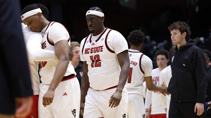 Mar 17, 2026; Dayton, OH, USA; NC State Wolfpack center Scottie Ebube (12) reacts after being defeated by Texas Longhorns during a first four game of the men's 2026 NCAA Tournament at University of Dayton Arena. Mandatory Credit: Rick Osentoski-Imagn Images Mar 17, 2026; Dayton, OH, USA; NC State Wolfpack center Scottie Ebube (12) reacts after being defeated by Texas Longhorns during a first four game of the men's 2026 NCAA Tournament at University of Dayton Arena. Mandatory Credit: Rick Osentoski-Imagn Images