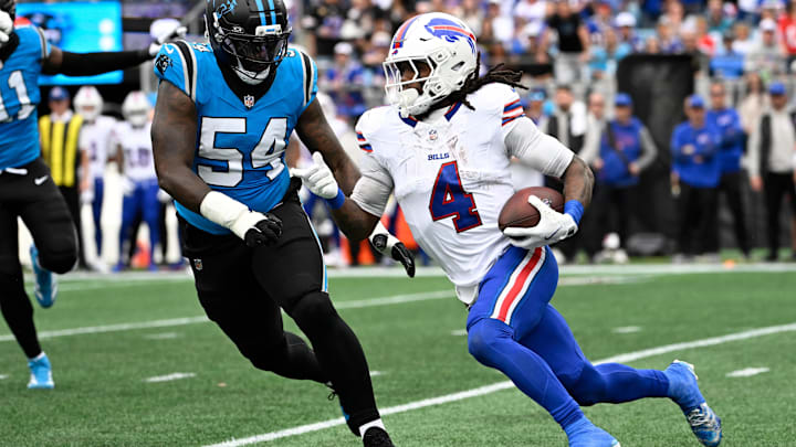 Buffalo Bills running back James Cook III runs against Carolina Panthers linebacker Boogie Basham. Buffalo Bills running back James Cook III runs against Carolina Panthers linebacker Boogie Basham.