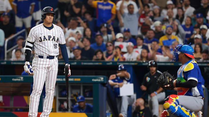 Mar 14, 2026; Miami, FL, United States; Japan designated hitter Shohei Ohtani (16) reacts toward Venezuela catcher Salvador Perez (13) in the seventh inning during a quarterfinal game of the 2026 World Baseball Classic at loanDepot Park. Mandatory Credit: Sam Navarro-Imagn Images