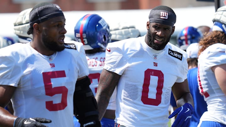 Jul 26, 2024; East Rutherford, NJ, USA; New York Giants linebacker Kayvon Thibodeaux (5) and New York Giants linebacker Brian Burns (0) break on the sideline during training camp at Quest Diagnostics Training Center. Jul 26, 2024; East Rutherford, NJ, USA; New York Giants linebacker Kayvon Thibodeaux (5) and New York Giants linebacker Brian Burns (0) break on the sideline during training camp at Quest Diagnostics Training Center.