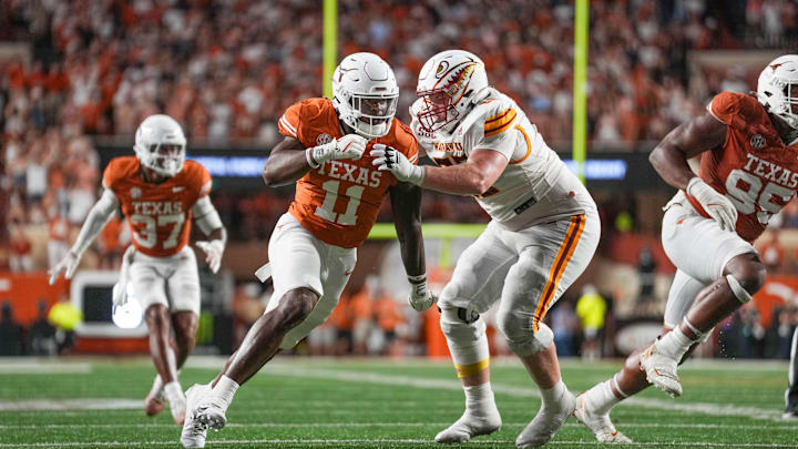 Sep 21, 2024; Austin, Texas, USA;  Texas Longhorns linebacker Colin Simmons (11) rushes in against Louisiana Monroe Warhawks offensive tackle Sam Carson (60) in the second half at Darrell K Royal-Texas Memorial Stadium. Mandatory Credit: Daniel Dunn-Imagn Images