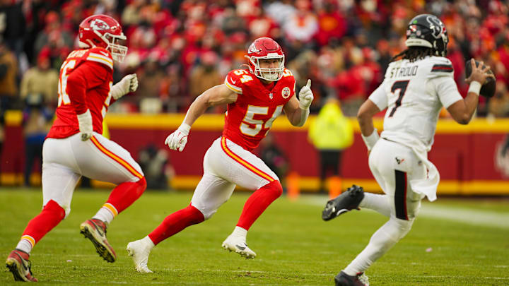 Jan 18, 2025; Kansas City, Missouri, USA; Kansas City Chiefs linebacker Leo Chenal (54) and defensive end George Karlaftis (56) pursue Houston Texans quarterback C.J. Stroud (7) during the first half in a 2025 AFC divisional round game at GEHA Field at Arrowhead Stadium. Mandatory Credit: Jay Biggerstaff-Imagn Images