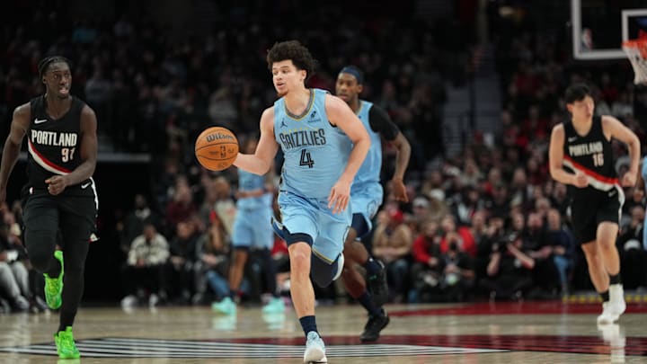 Feb 7, 2026; Portland, Oregon, USA; Memphis Grizzlies guard Walter Clayton Jr. (4) brings the ball up court during the first half against the Portland Trail Blazers at Moda Center. Mandatory Credit: Soobum Im-Imagn Images