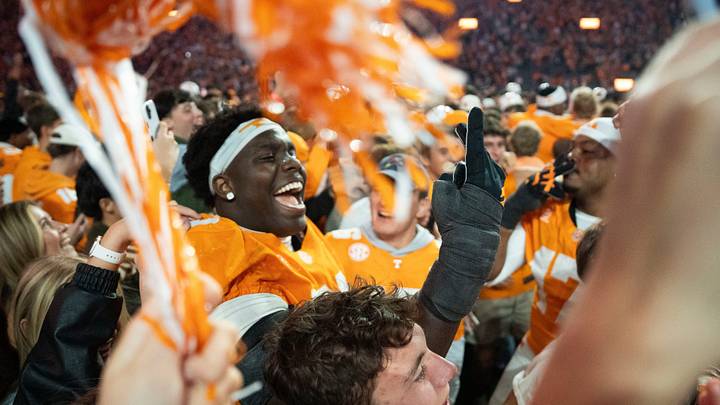 Tennessee offensive lineman David Sanders Jr. (70) celebrates with fans after they storm the field Tennessee offensive lineman David Sanders Jr. (70) celebrates with fans after they storm the field