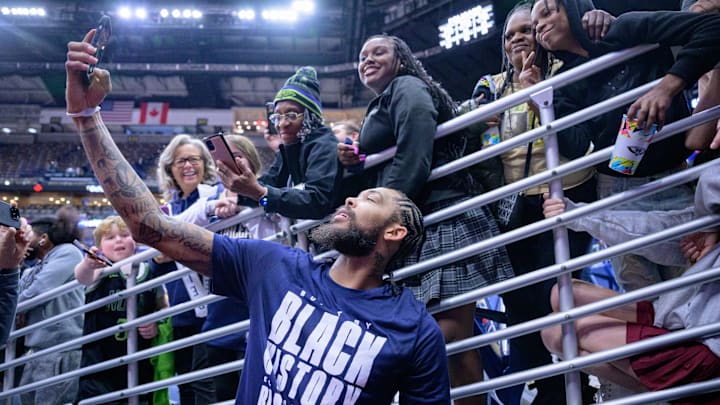 Feb 5, 2024; New Orleans, Louisiana, USA; New Orleans Pelicans forward Brandon Ingram celebrates with fans after defeating the Toronto Raptors at Smoothie King Center. Mandatory Credit: Matthew Hinton-Imagn Images