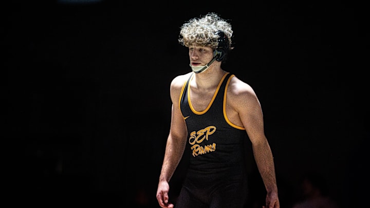 Southeast Polk’s Justis Jesuroga steps onto the mat for a duel against Johnston’s Wyatt O’Dell on Dec. 4, 2025, at Southeast Polk High School. Southeast Polk’s Justis Jesuroga steps onto the mat for a duel against Johnston’s Wyatt O’Dell on Dec. 4, 2025, at Southeast Polk High School.