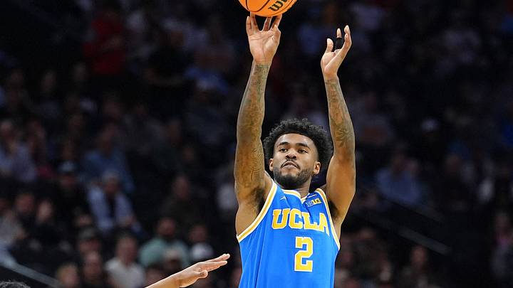 Mar 22, 2026; Philadelphia, PA, USA; UCLA Bruins guard Donovan Dent (2) shoots the ball against the UConn Huskies in the first half during a second round game of the men's 2026 NCAA Tournament at Xfinity Mobile Arena. Mar 22, 2026; Philadelphia, PA, USA; UCLA Bruins guard Donovan Dent (2) shoots the ball against the UConn Huskies in the first half during a second round game of the men's 2026 NCAA Tournament at Xfinity Mobile Arena.
