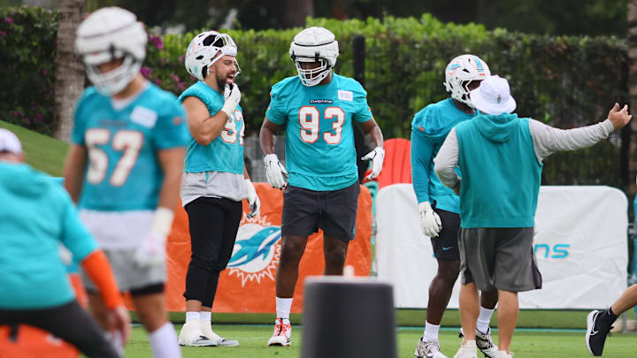 Miami Dolphins defensive tackle Zach Sieler (92) talks to defensive tackle Calais Campbell (93) during training camp at Baptist Health Training Complex. Miami Dolphins defensive tackle Zach Sieler (92) talks to defensive tackle Calais Campbell (93) during training camp at Baptist Health Training Complex.