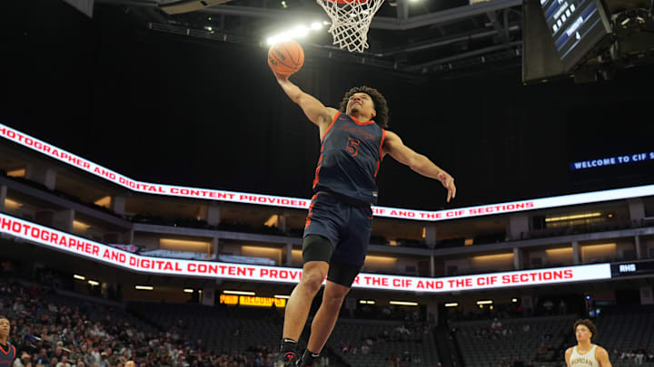 Brayden Burries of Roosevelt soars in for a dunk during the California (CIF) State Open Division title game at the Golden 1 Center in Sacramento.