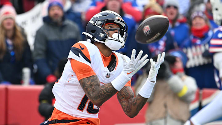 Jan 12, 2025; Orchard Park, New York, USA; Denver Broncos wide receiver Troy Franklin (16) catches a touchdown pass against the Buffalo Bills during the first quarter in an AFC wild card game at Highmark Stadium. Mandatory Credit: Mark Konezny-Imagn Images