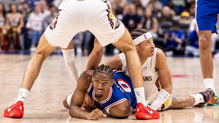Feb 21, 2026; New Orleans, Louisiana, USA;  Philadelphia 76ers guard Tyrese Maxey (0) and New Orleans Pelicans guard Jeremiah Fears (0) fight for possession during the second half at Smoothie King Center. Mandatory Credit: Stephen Lew-Imagn Images