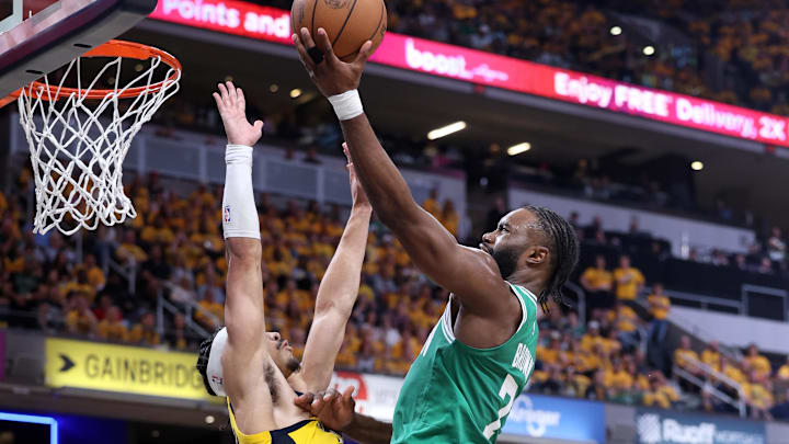 May 25, 2024; Indianapolis, Indiana, USA; Boston Celtics guard Jaylen Brown (7) shoots the ball against Indiana Pacers guard Andrew Nembhard (2) during the third quarter of game three of the eastern conference finals in the 2024 NBA playoffs at Gainbridge Fieldhouse. Mandatory Credit: Trevor Ruszkowski-USA TODAY Sports