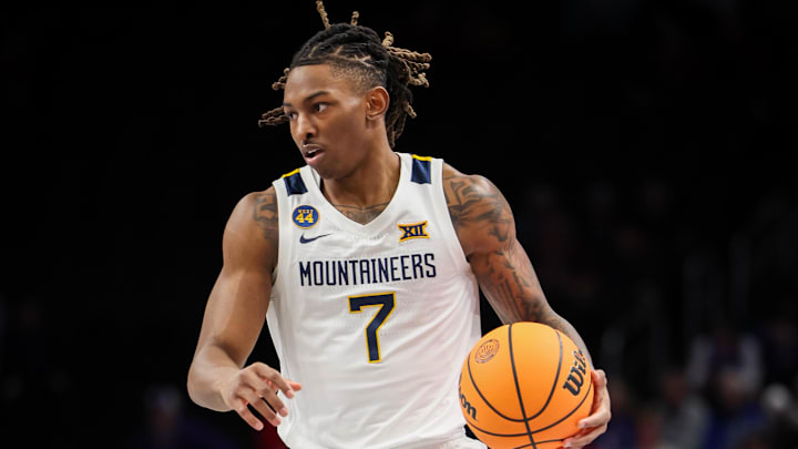 Mar 12, 2025; Kansas City, MO, USA; West Virginia Mountaineers guard Javon Small (7) brings the ball up court during the first half against the Colorado Buffaloes at T-Mobile Center. Mandatory Credit: William Purnell-Imagn Images