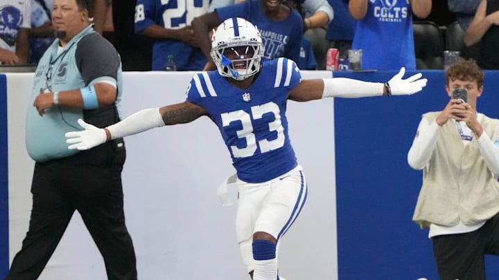 Indianapolis Colts cornerback Micah Abraham (33) celebrates after he scores a touchdown after intercepting a ball during the second half of a preseason game against the Denver Broncos on Sunday, Aug. 11, 2024, at Lucas Oil Stadium in Indianapolis. The Broncos defeated the Colts 34-30.