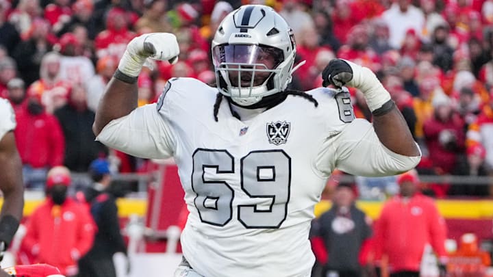 Nov 29, 2024; Kansas City, Missouri, USA; Las Vegas Raiders defensive tackle Adam Butler (69) celebrates after making a sack against the Kansas City Chiefs during the second half at GEHA Field at Arrowhead Stadium. Mandatory Credit: Denny Medley-Imagn Images