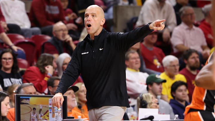 Jan 10, 2026; Ames, Iowa, USA; Oklahoma State Cowboys head coach Steve Lutz watches his team play the Iowa State Cyclones during the second half at James H. Hilton Coliseum. Mandatory Credit: Reese Strickland-Imagn Images