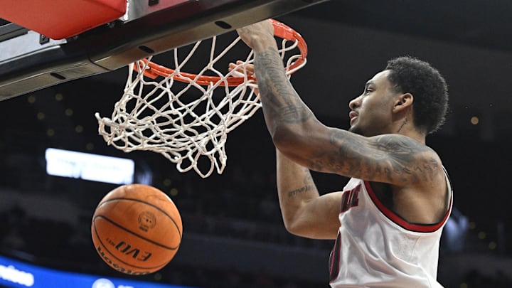 Dec 11, 2024; Louisville, Kentucky, USA;  Louisville Cardinals forward Khani Rooths (9) dunks against the UTEP Miners during the second half at KFC Yum! Center. Louisville defeated Texas-El Paso 77-74.