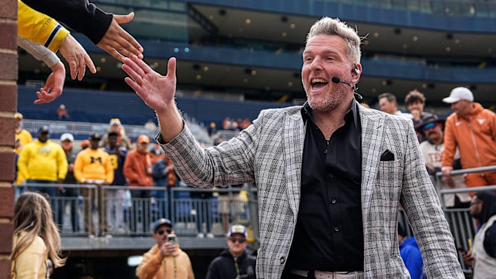 ESPN College GameDay's Pat McAfee high-fives fans as he takes the field before the game between Michigan and Texas at Michigan. ESPN College GameDay's Pat McAfee high-fives fans as he takes the field before the game between Michigan and Texas at Michigan.