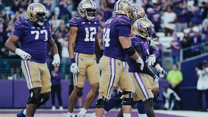 Max McCree (77) hustles to join the celebration for a Jonah Coleman touchdown run. Max McCree (77) hustles to join the celebration for a Jonah Coleman touchdown run.
