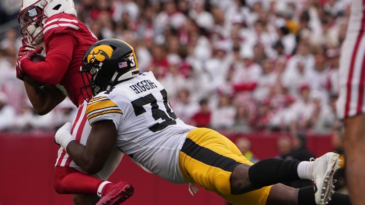 Oct 14, 2023; Madison, Wisconsin, USA; Wisconsin Badgers wide receiver Will Pauling (6) is tackled short of a first down by Iowa Hawkeyes linebacker Jay Higgins (34) during the second quarter at Camp Randall Stadium. Mandatory Credit: Mark Hoffman-USA TODAY Sports