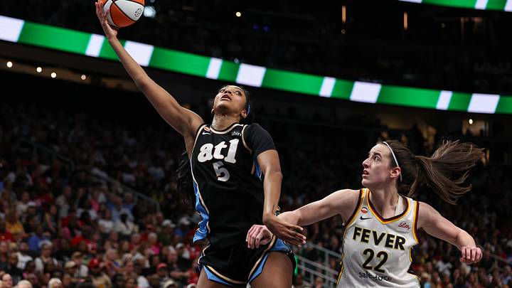 Aug 16, 2026; Atlanta, Georgia, USA; Atlanta Dream forward Angel Reese (5) shoots against Indiana Fever guard Caitlin Clark (22) during the third quarter at State Farm Arena. Mandatory Credit: Colin Hubbard-Imagn Images