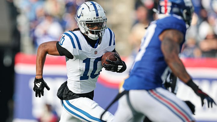 Dec 29, 2024; East Rutherford, New Jersey, USA; Indianapolis Colts wide receiver Adonai Mitchell (10) gains yards after catch during the first half against the New York Giants at MetLife Stadium. Mandatory Credit: Vincent Carchietta-Imagn Images