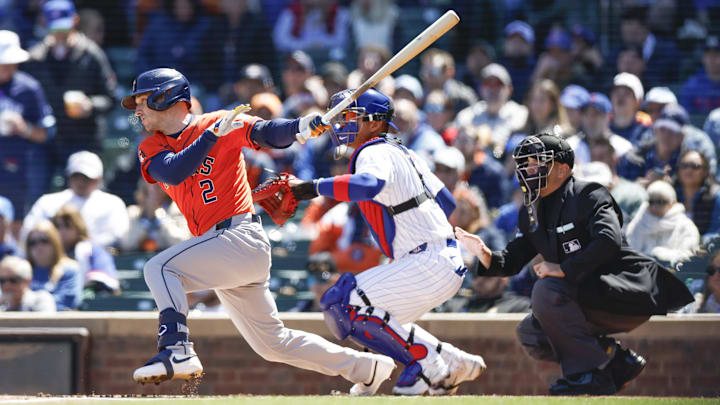 Apr 25, 2024; Chicago, Illinois, USA; Houston Astros third baseman Alex Bregman (2) singles against the Chicago Cubs during the first inning at Wrigley Field.