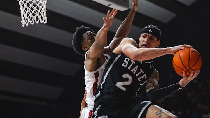 Feb 25, 2025; Tuscaloosa, Alabama, USA; Mississippi State Bulldogs guard Riley Kugel (2) passes against Alabama Crimson Tide forward Mouhamed Dioubate (10) during the first half at Coleman Coliseum. Mandatory Credit: Will McLelland-Imagn Images