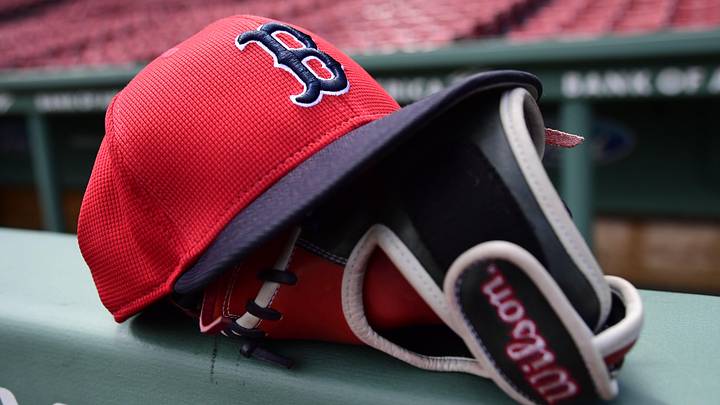 May 18, 2025; Boston, Massachusetts, USA; A Boston Red Sox hat and glove rests on the railing by the dugout prior to a game against the Atlanta Braves at Fenway Park. Mandatory Credit: Bob DeChiara-Imagn Images May 18, 2025; Boston, Massachusetts, USA; A Boston Red Sox hat and glove rests on the railing by the dugout prior to a game against the Atlanta Braves at Fenway Park. Mandatory Credit: Bob DeChiara-Imagn Images