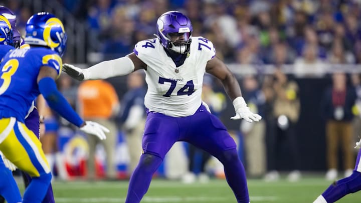 Jan 13, 2025; Glendale, AZ, USA; Minnesota Vikings offensive tackle Cam Robinson (74) against the Los Angeles Rams during an NFC wild card game at State Farm Stadium. Mandatory Credit: Mark J. Rebilas-Imagn Images