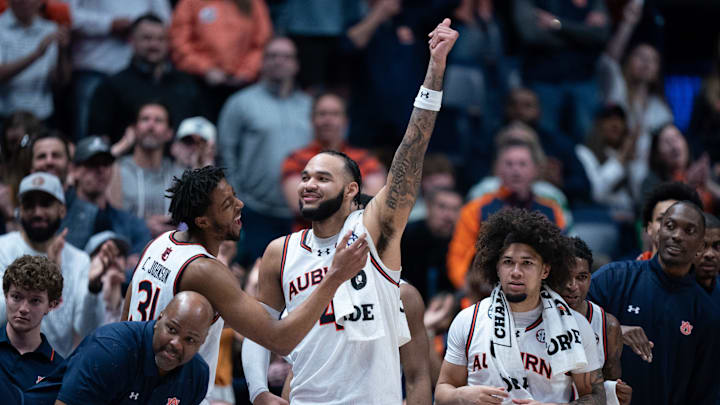The Auburn starters celebrate their impending win over Florida in the SEC Men's Basketball