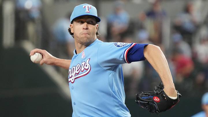Texas Rangers pitcher Jacob deGrom throws a baseball.