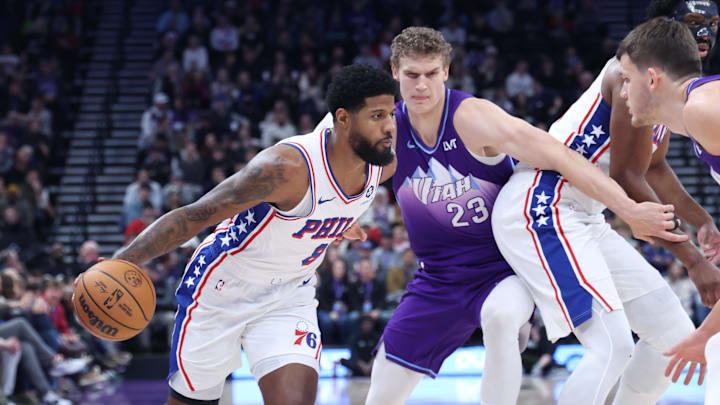 Dec 28, 2024; Salt Lake City, Utah, USA; Philadelphia 76ers forward Paul George (8) dribbles against Utah Jazz forward Lauri Markkanen (23) during the first quarter at Delta Center. Mandatory Credit: Rob Gray-Imagn Images