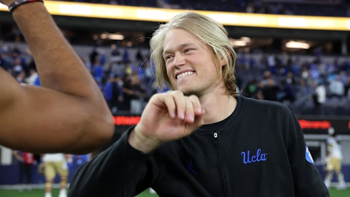 Dec 16, 2023; Inglewood, CA, USA; UCLA Bruins wide receiver coach Jerry Neuheisel celebrates a victory after defeating the Boise State Broncos in the LA Bowl at SoFi Stadium. Mandatory Credit: Kiyoshi Mio-Imagn Images
