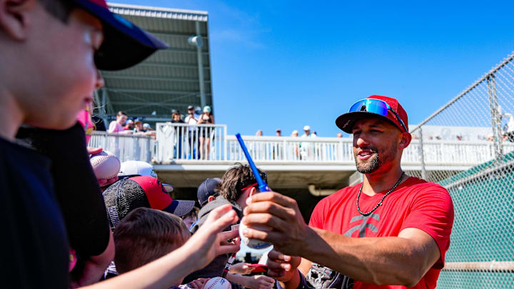 Infielder Royce Lewis signs merch for young fans during the Minnesota Twins' first full-squad workout of spring training at the Lee Health Sports Complex in Fort Myers, Fla., on Monday, Feb. 17, 2025.