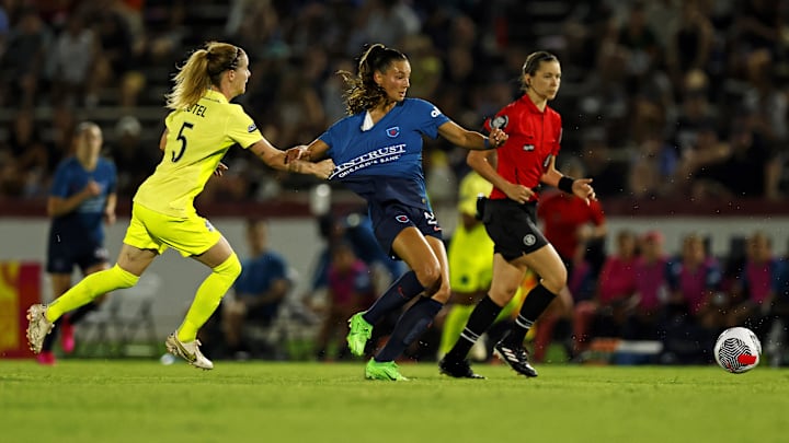 Chicago Red Stars midfielder Jenna Bike (24) is fouled  by Washington Spirit defender Annaig Butel (5) during the second half in the NWSL Summer Cup Tournament at City Stadium 
