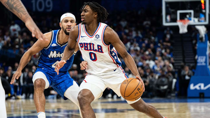 Jan 19, 2024; Orlando, Florida, USA; Philadelphia 76ers point guard Tyrese Maxey (0) dribbles the ball against the Orlando Magic in the first quarter at KIA Center. Mandatory Credit: Jeremy Reper-Imagn Images