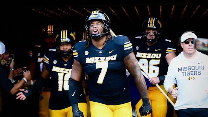 Sep 6, 2025; Columbia, Missouri, USA; Missouri Tigers defensive tackle Chris McClellan leads the defensive linemen onto the field for the Border War between the Tigers and Kansas Jayhawks at Faurot Field at Memorial Stadium. Sep 6, 2025; Columbia, Missouri, USA; Missouri Tigers defensive tackle Chris McClellan leads the defensive linemen onto the field for the Border War between the Tigers and Kansas Jayhawks at Faurot Field at Memorial Stadium.