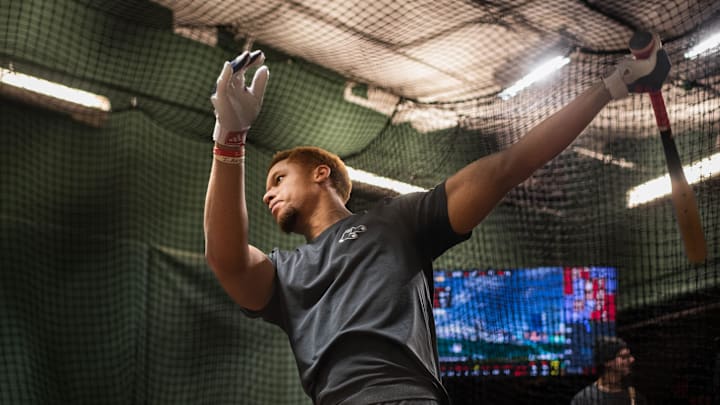 Red Sox prospect Kristian Campbell takes some swings inside the batting cage at Fenway Park on Tuesday.