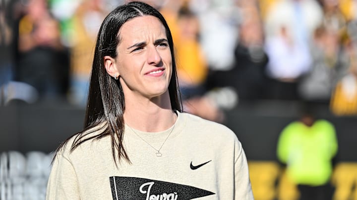 Oct 26, 2024; Iowa City, Iowa, USA; Former Iowa Hawkeye and current Indiana Fever WNBA star Caitlin Clark looks on while being honored during the game between the Iowa Hawkeyes and the Northwestern Wildcats at Kinnick Stadium. Mandatory Credit: Jeffrey Becker-Imagn Images Oct 26, 2024; Iowa City, Iowa, USA; Former Iowa Hawkeye and current Indiana Fever WNBA star Caitlin Clark looks on while being honored during the game between the Iowa Hawkeyes and the Northwestern Wildcats at Kinnick Stadium. Mandatory Credit: Jeffrey Becker-Imagn Images