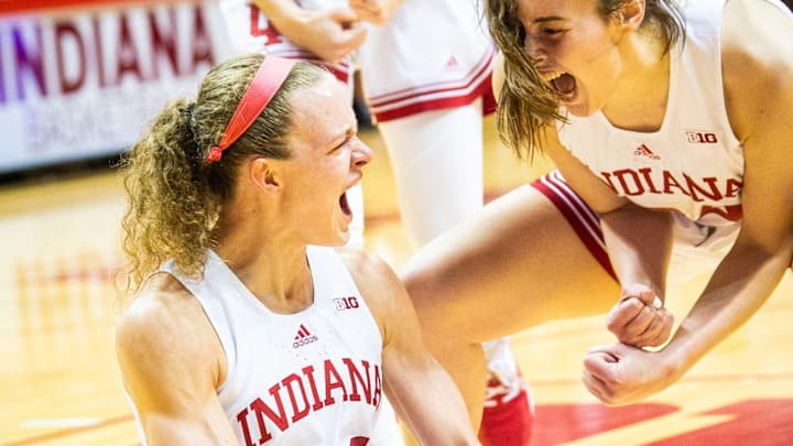 Indiana's Grace Berger (34) and Mackenzie Holmes (54) celebrate Berger taking a charge during the first half of the Indiana versus Ohio State women's basektball game at Simon Skjodt Assembly Hall on Thursday, Jan. 26, 2023.